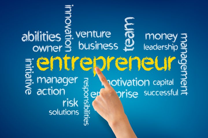 Hand pointing at a Entrepreneur word illustration on blue background.